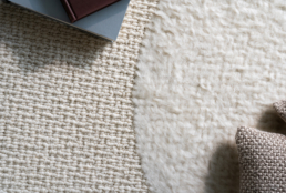 Wool & Wire carpet close-up shot with books and pillow